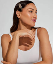 Woman wearing Ohra Smokey Untouched Hair Clips during her skincare routine