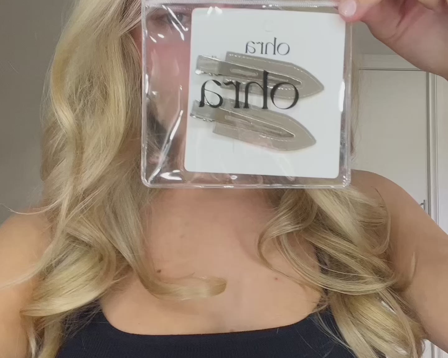Video of a woman applying Untouched Hair Clips during her makeup routine
