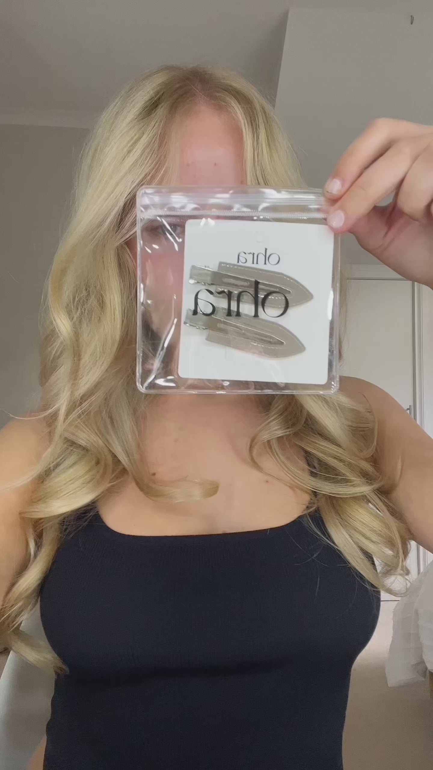 Video of a woman applying Untouched Hair Clips during her makeup routine