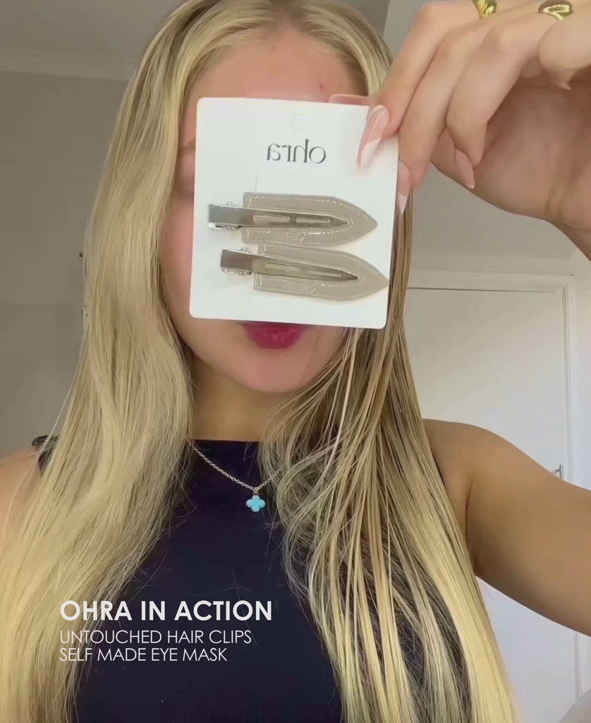 Video of blonde woman applying the Ohra Self Made Eye Mask and Ohra Untouched Hair Clips in Smokey during her routine